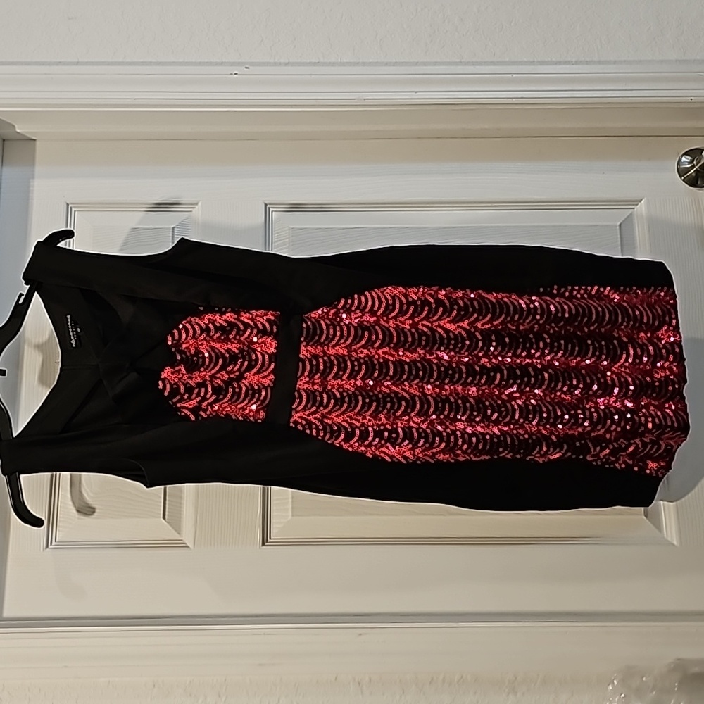 Black knee length party dress with pink sequins